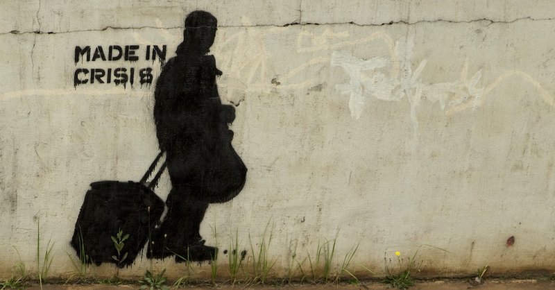 Graffiti zeigt einen Menschen mit Gepäck